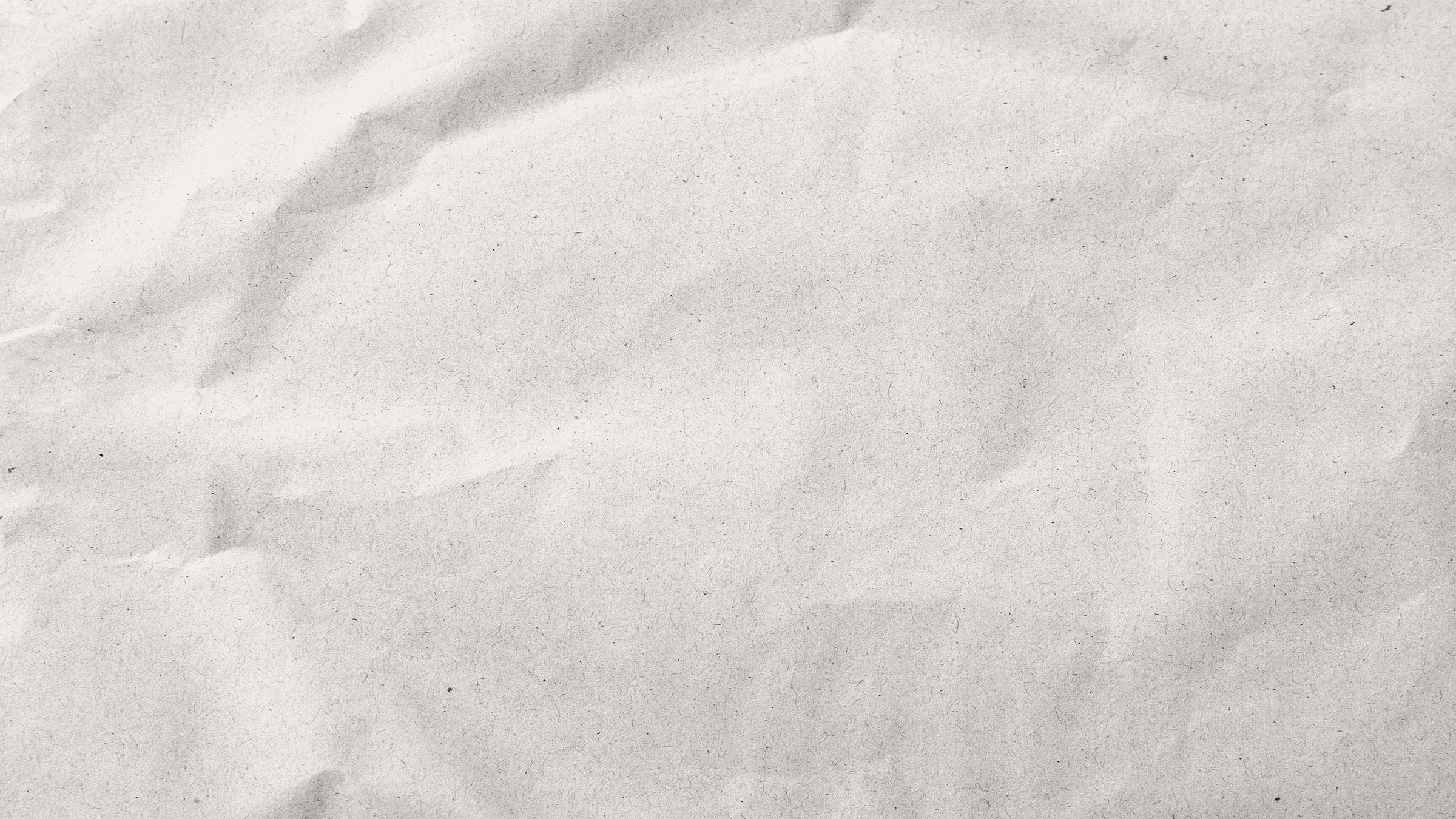 Close-up texture of paper, evoking financial documentation and records.